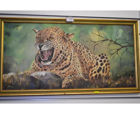 Oil on canvas of a leopard, initialled M lower left, 83cm x 44cm inclusive of frame. Vendor states that it bought from Treeto