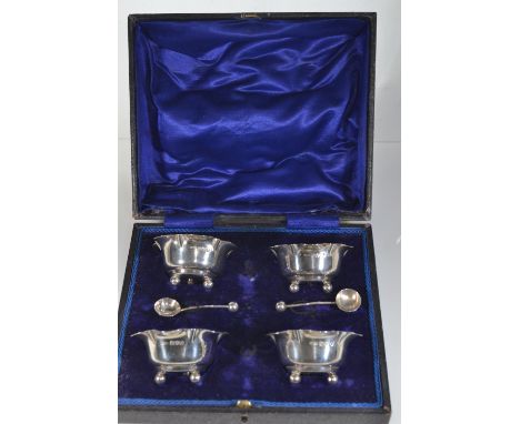 Cased set of four silver salts, maker Henry Williamson Ltd, Chester 1909, together with two salt spoons, maker M & J, Chester