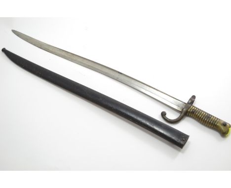 A French M1866 Chassepot Yataghan Sword Bayonet. L70.5cm. Back of blade impressed 'St Etienne 1868'. Includes scabbard with n