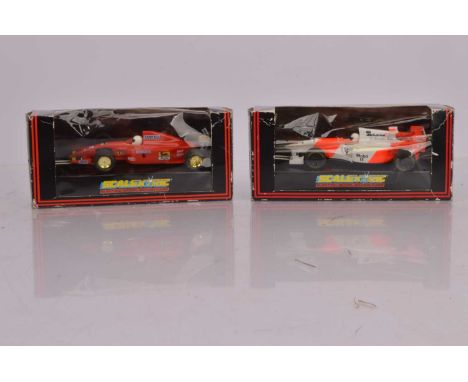 Two Scalextric F1 Cars, C410 red Ferrari 643 and C585  red/white McLaren Mercedes MP/4 No 7, both in original window boxes, V