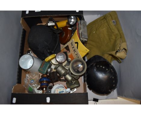 A miscellany of items including vintage helmets, 1942 MKII gas mask bag,tape measure and more.
