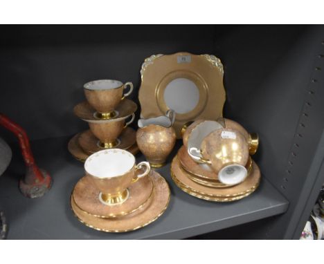An early 20th Century Tuscan bone china tea service, comprising 6 cups and saucers, 6 , side plates , cream jug and side plat