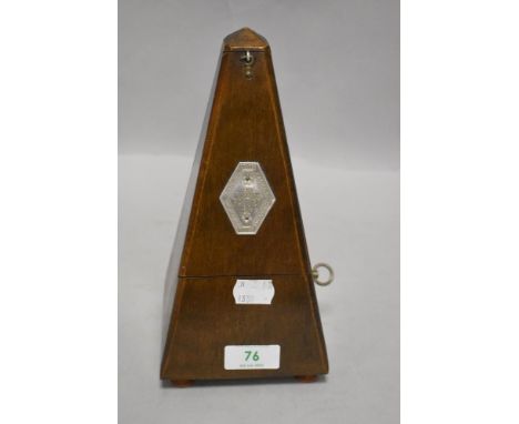 A traditional metronome, labelled Paquet, in running order