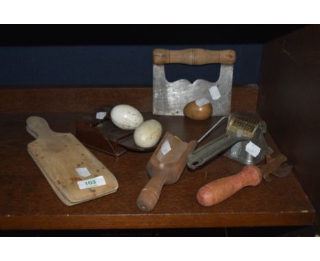A selection of vintage kitchen items etc including butter pats, brooder eggs, treen scoop and Moulin Legumes food mill