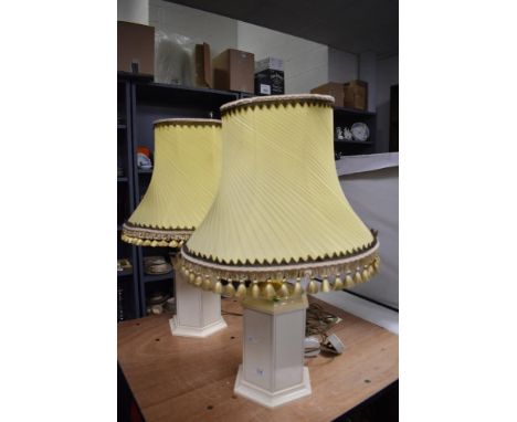 A pair of modern table lamps with vintage style shades