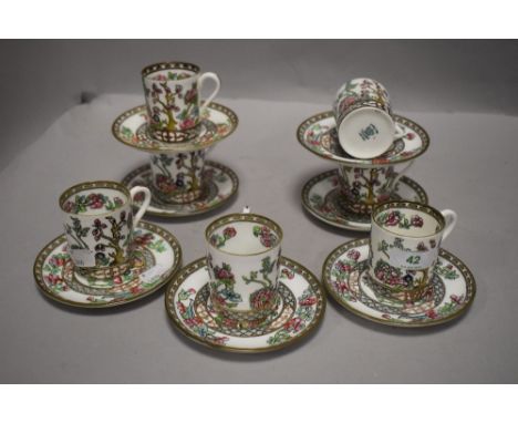 A set of seven early 20th Century Coalport coffee cans and saucers, Indian tree transfer print