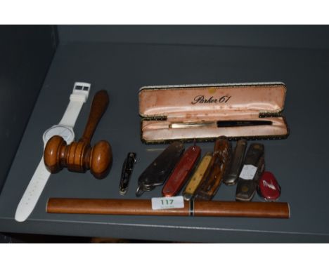 A selection of penknives, parker 61 pen, swatch watch and a wooden gavel