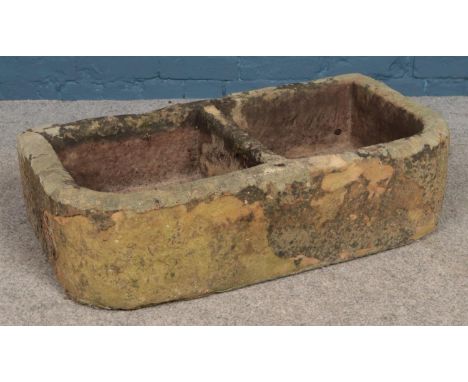 A large two-segment garden trough. Height: 21cm, Width: 80cm Depth: 43cm.  Cracks to corners.