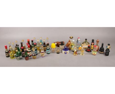 A box of novelty and miniature alcohol bottles. To include a selection of Bols (Cherry Brandy, Orange Curaco and Bananes) and