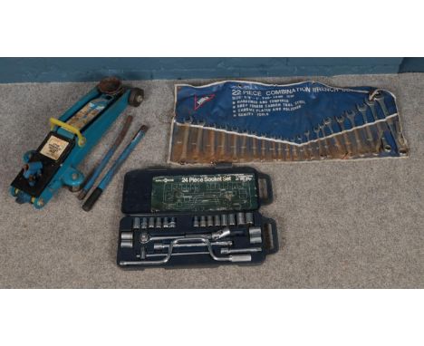 An assortment of tools. To include a Hilka 22 piece Wrench set, Halfords 24 piece socket set and a 2 ton trolley jack.  