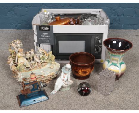 A box of miscellaneous items, mostly ceramics and glassware. To include moonflower paperweight, Nao figurine, West German vas