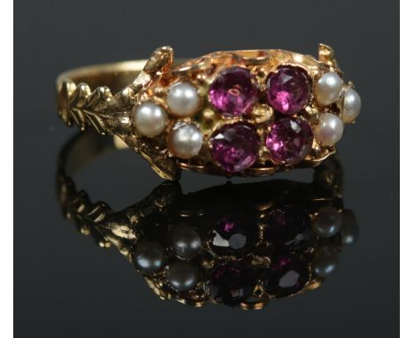 A Victorian gold, Almandine garnet and seed pearl ring. Size O. 2.63g. Tests as high carat.  