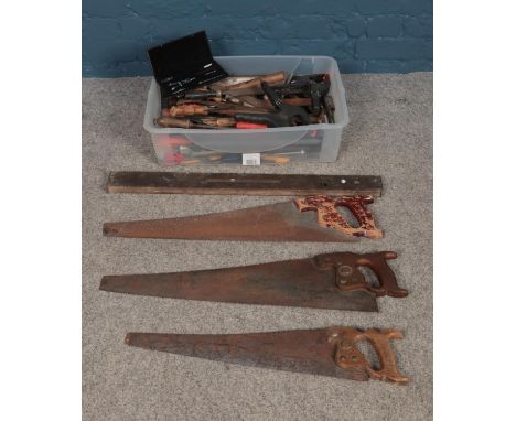 A large quantity of vintage tools; to include saws, spirit level and woodworking files.  