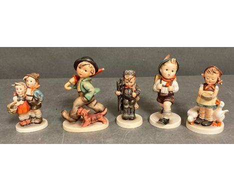 A selection of five Hummel figures