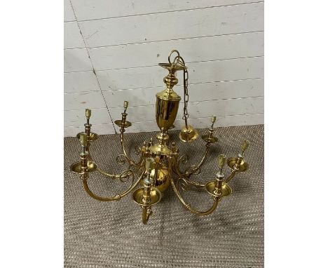 A large brass eight scroll arm chandelier (approx 75cm x 75cm without chain)