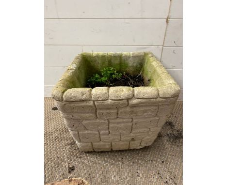A square planter in the form of a stones 