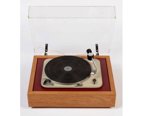 A Thorens TD 135 turntable with light oak Loricraft plinth, black armboard, fitted a Thorens arm (no cartridge).