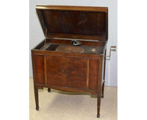 A 1930's wind-up DECCA gramophone in rectangular walnut cabinet, with two doors and fret-cut speaker grille, on square taperi