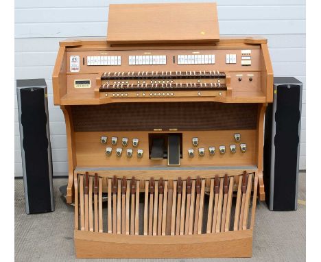 An Ahlborn digital pipe organ with detachable pedal board, light oak case, 146cms wide, together with three Ahlborn archive m