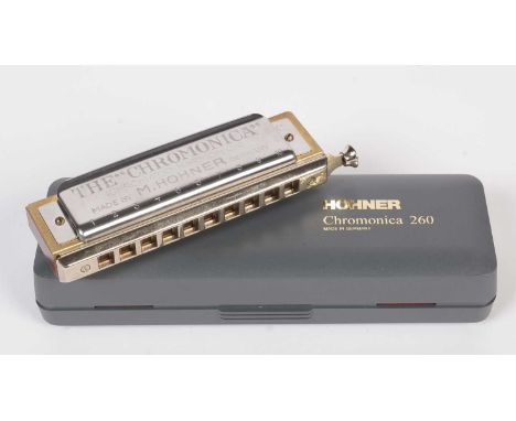 A Hohner Chromonica 260 ten hole chromatic harmonica in C, plastic fitted box.