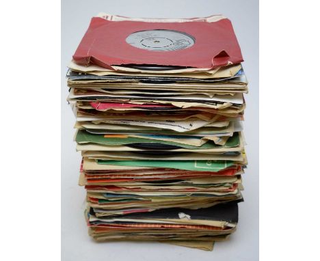 A collection of mixed 7" singles, artists to include: The Moody Blues; The Beatles; Ian Dury; a signed Tim Healy; America; Da