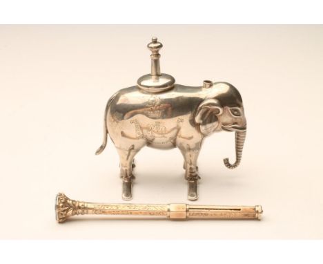 DUKE OF WELLINGTON'S WEST RIDING REGIMENT, an EPNS novelty table lighter in the form of an elephant standing on two bars, 2 3