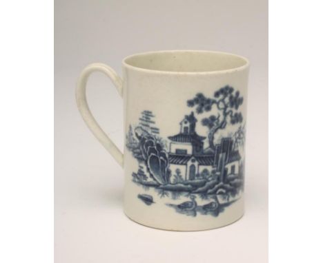 A FIRST PERIOD WORCESTER "PLANTATION" PATTERN PORCELAIN SMALL MUG, c.1775, of plain cylindrical form, painted in underglaze b