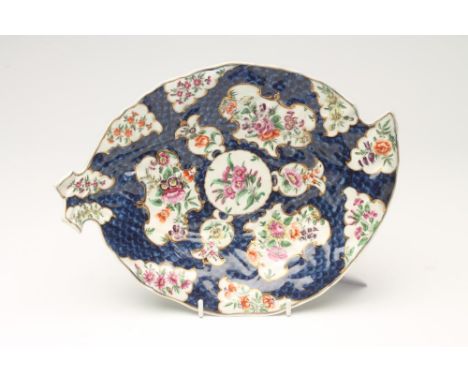 A FIRST PERIOD WORCESTER PORCELAIN LEAF DISH, c.1770, painted in polychrome enamels with flower sprays within shaped reserves