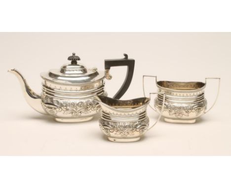 A BACHELOR'S LATE VICTORIAN SILVER THREE PIECE TEA SERVICE, maker Jackson & Fullerton, London, 1898, (teapot 1910), of rounde