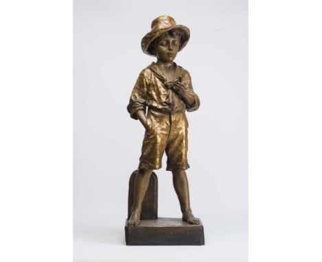 A LARGE GOLDSCHEIDER EARTHENWARE FIGURE, late 19th century, modelled as a young boy wearing a hat, open necked shirt with a '