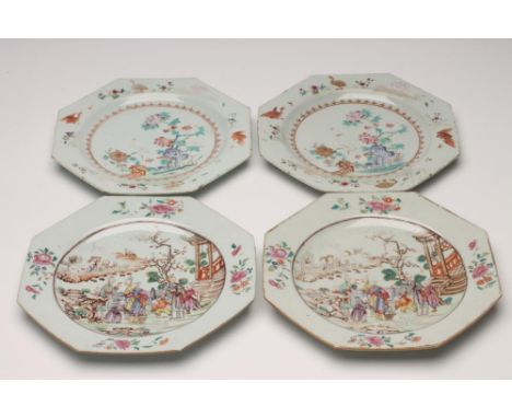 A PAIR OF CHINESE PORCELAIN PLATES of octagonal form, centrally painted in famille rose enamels with figures and a dog in a g