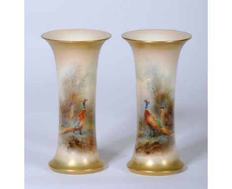 A PAIR OF ROYAL WORCESTER CHINA VASES, 1921, of waisted cylindrical form painted in polychrome enamels by James Stinton with 