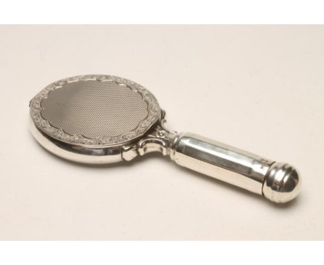 A CONTINENTAL NOVELTY COMPACT, maker's mark HB, stamped 835, designed as a hand mirror, the oval mirror plate in a scalloped 
