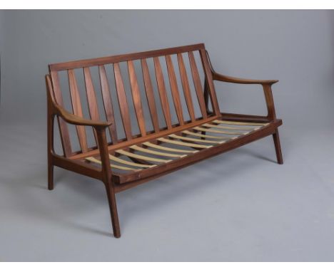 A DANISH TEAK FRAMED SOFA, 1960'S, the slatted raked back with straight top rail, shaped open arms on rounded square section 