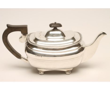 AN EDWARDIAN SILVER TEAPOT, maker J & R Attenborough & Co. Ltd., Sheffield 1910, of rounded oblong form, the flat hinged cove