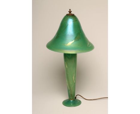 J. DITCHFIELD - a glass electric table lamp base, the green iridescent high mushroom shade on a rounded cylindrical stem and 