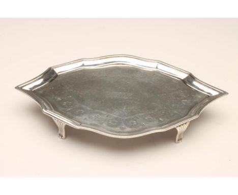 A LATE GEORGE III SILVER TEAPOT STAND, makers Peter & Ann Bateman, London 1795, of shaped eliptical form with pie-crust rim e