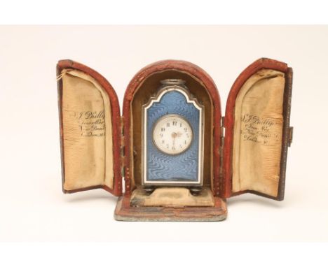 A CONTINENTAL MINIATURE CARRIAGE CLOCK, indistinctly marked, the circular white enamel dial with black Arabic numerals, blue 