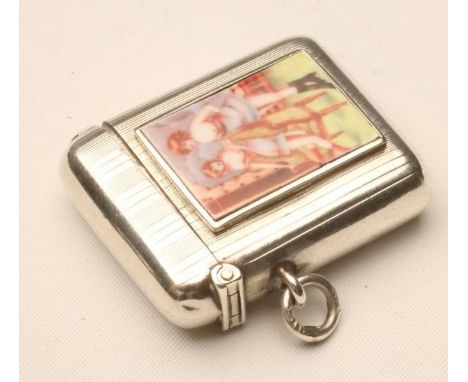 AN EDWARDIAN SILVER AND ENAMEL VESTA CASE, maker's mark W.N., of plain rounded oblong form with engine turned stripes, the fa