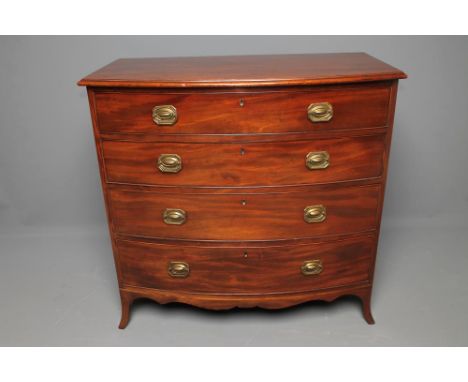A REGENCY MAHOGANY CHEST of bowed form, the moulded edged top over four drawers with oblong brass drop handles, shaped apron 