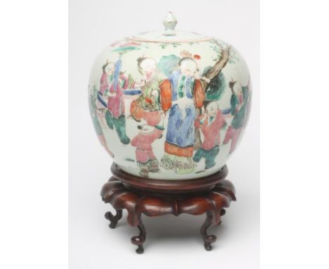 A CHINESE PORCELAIN JAR AND COVER of ovoid form, painted in famille rose enamels with children playing beneath a tree, unmark