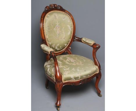 A VICTORIAN WALNUT FRAMED SALON CHAIR of balloon back form upholstered in green silk chinoiserie tapestry, the channelled fra