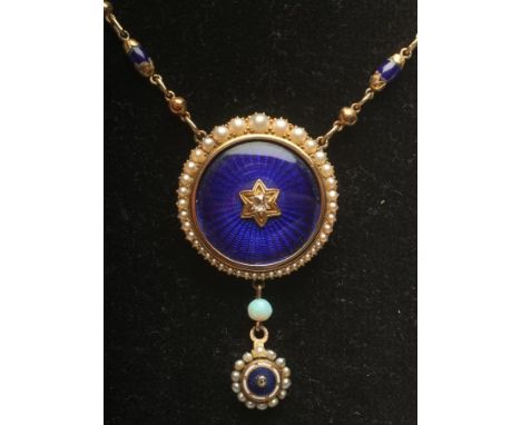 A VICTORIAN NECKLACE, the link and ball chain with ten blue bead spacers and fixed to a blue guilloche enamelled roundel cent