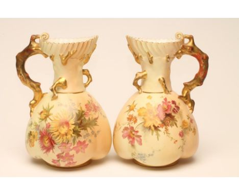 A PAIR OF ROYAL WORCESTER CHINA "CORAL" HANDLED JUGS, 1896, of lobed form with shaped rims, painted in polychrome enamels wit