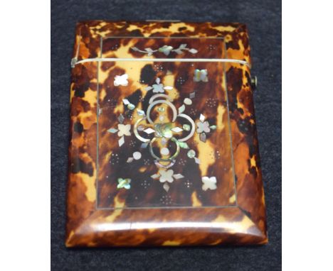 A tortoiseshell and mother of pearl card case