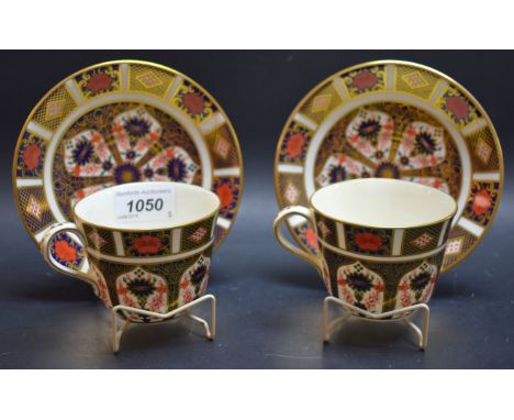 A pair of Royal Crown Derby 1128 Imari cups and saucers, first quality