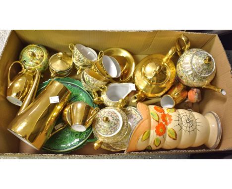 A Continental porcelain six setting diminutive tea service, boldly gilt; another tea service, picked out with gilt foliate te