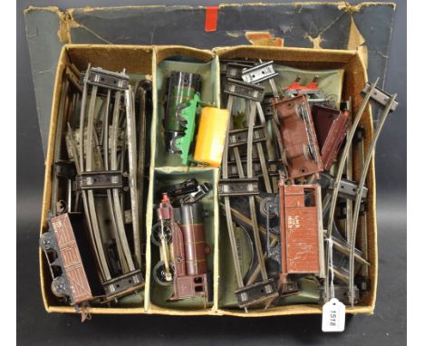 A Hornby O gauge tin plate train set, comprising 0-4-0 locomotive and tender, LMS burgundy livery, black and yellow detail, N