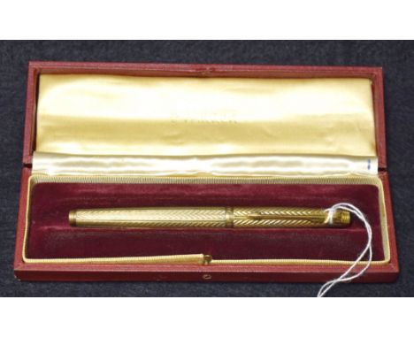 A Parker silver gilt fountain pen, with engine turned with the Fougere pattern decoration throughout, arrow clip, a compressi