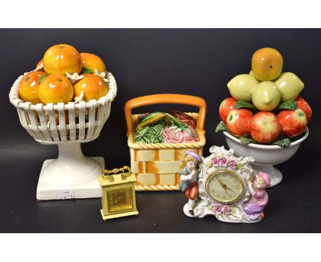 An Asprey Luxor miniature mantel timepiece clock; a Meiko porcelain mounted mantel clock; a ceramic fruit basket; two others 